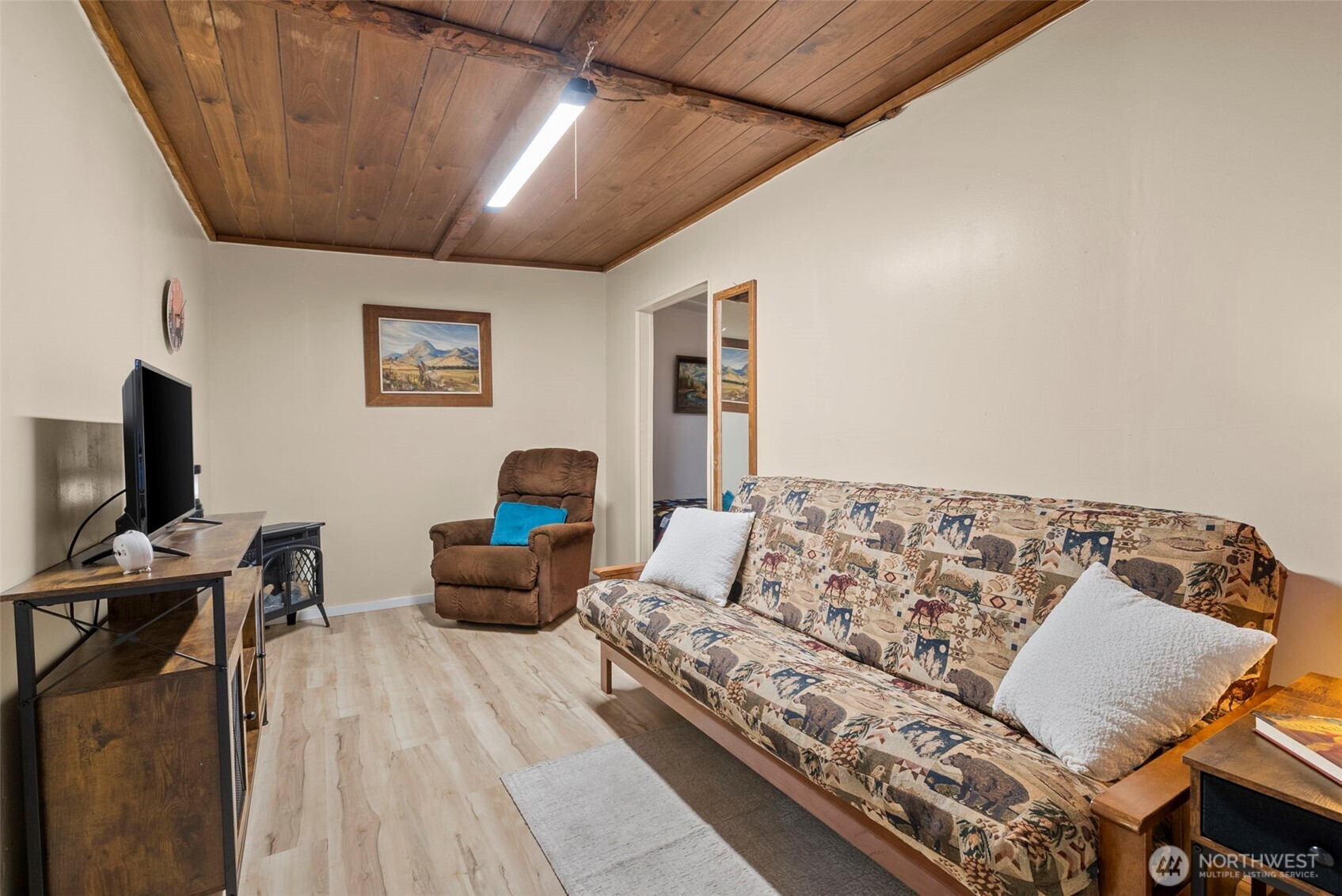560 North Beacon Point Loop North Lilliwaup, WA 98555 - Photo 18 of 40 a living room with furniture and a flat screen tv