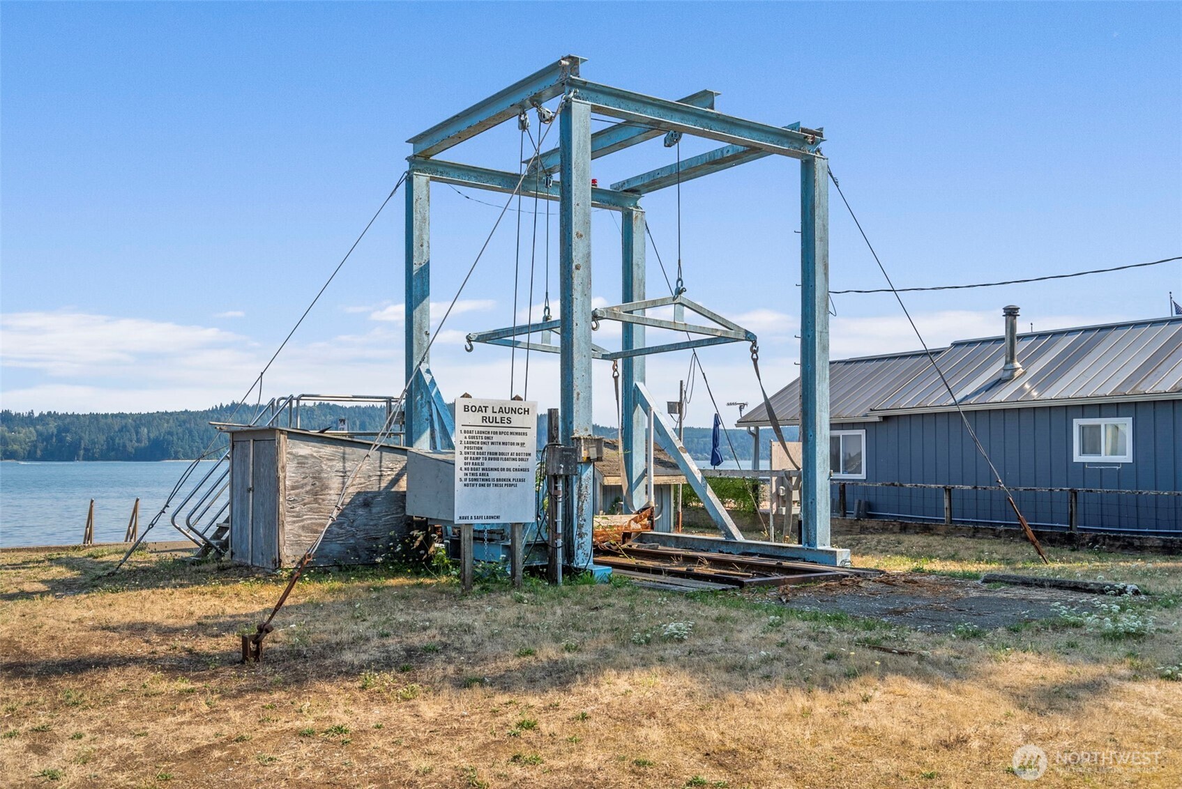 560 North Beacon Point Loop North Lilliwaup, WA 98555 - Photo 37 of 40 a view of a house with a wooden fence