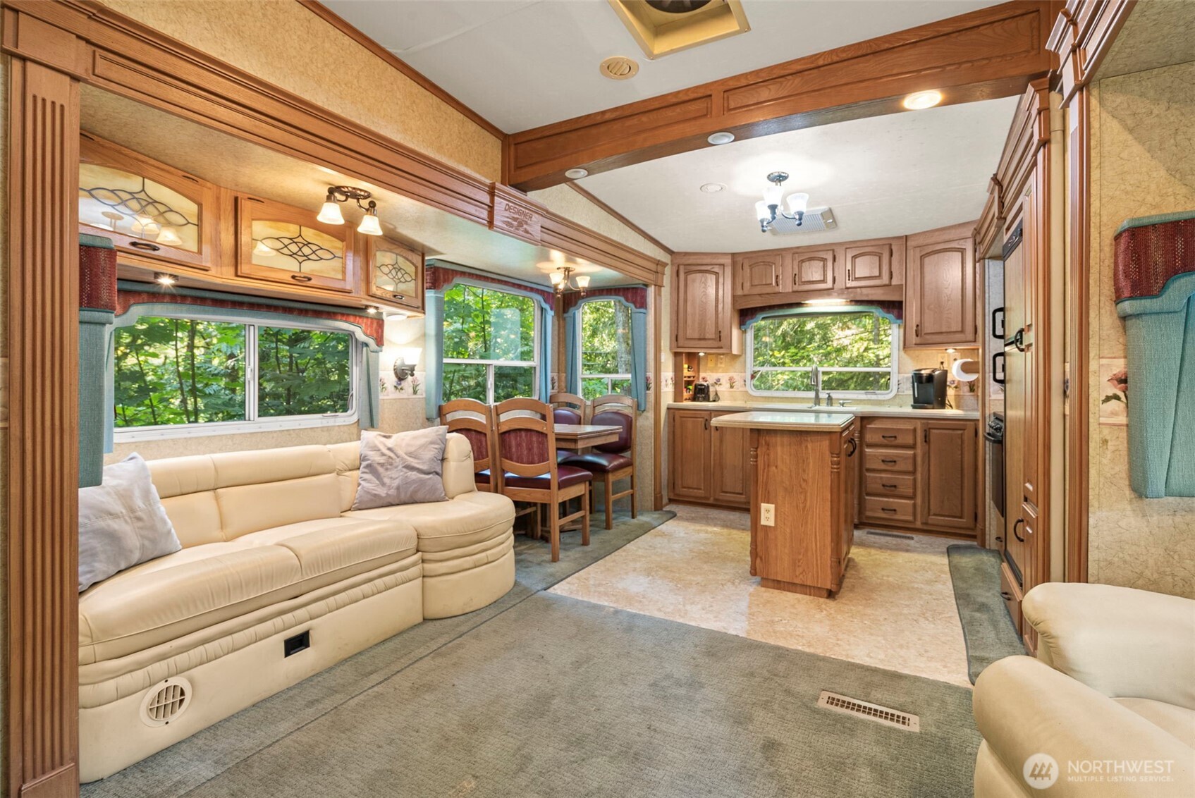 560 North Beacon Point Loop North Lilliwaup, WA 98555 - Photo 9 of 40 a living room with furniture and a large window