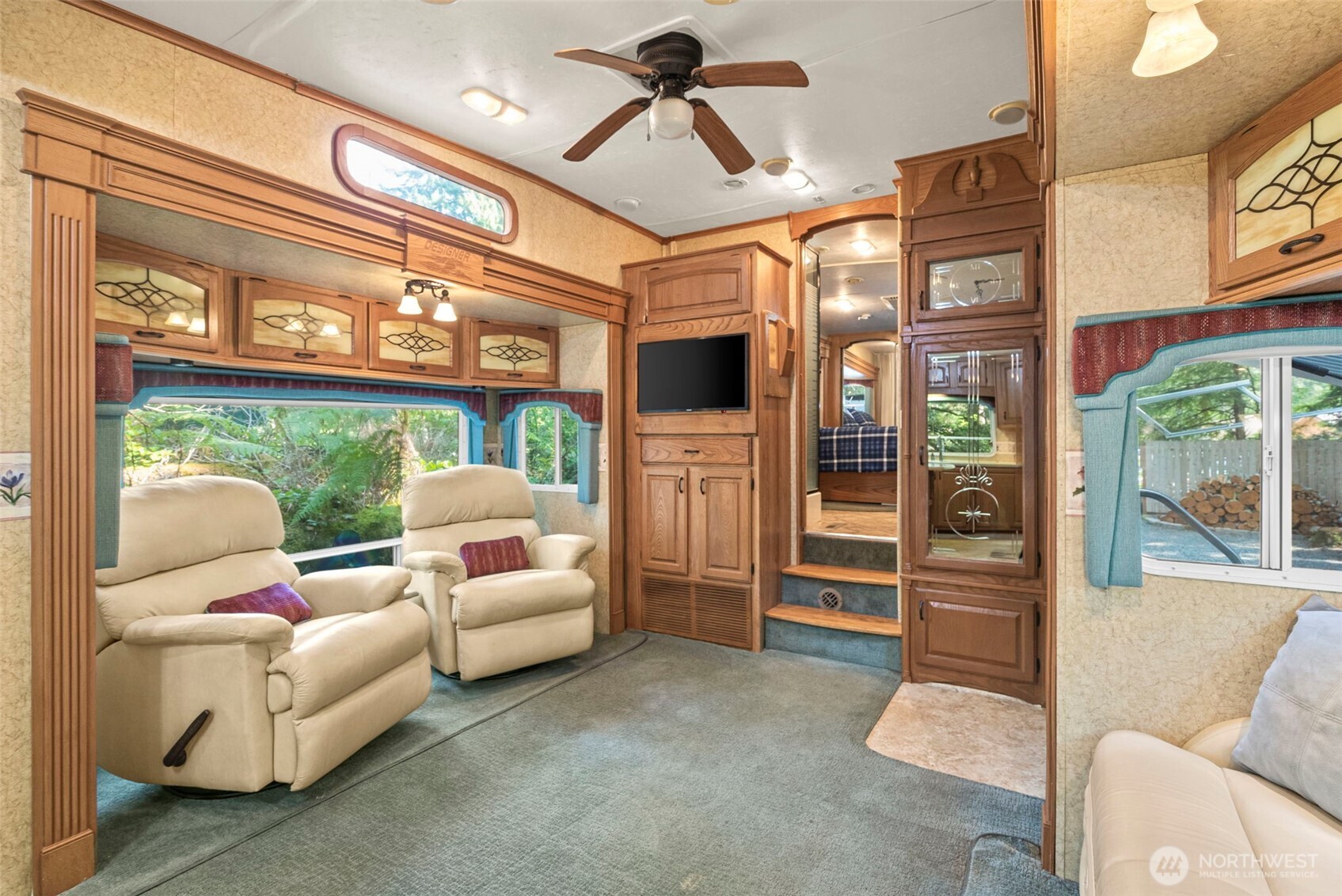 560 North Beacon Point Loop North Lilliwaup, WA 98555 - Photo 10 of 40 a living room with furniture and a large window