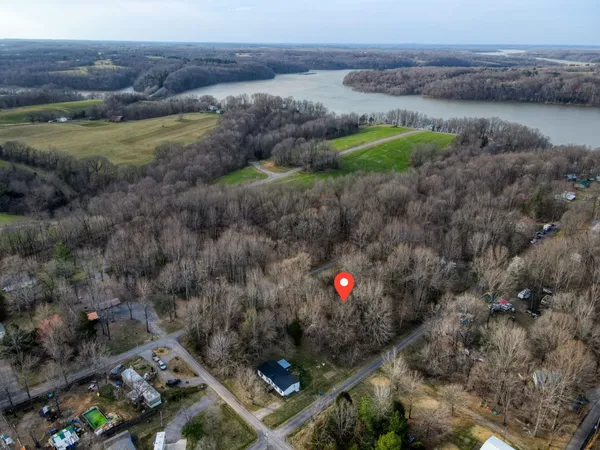 a aerial view of a house with a yard