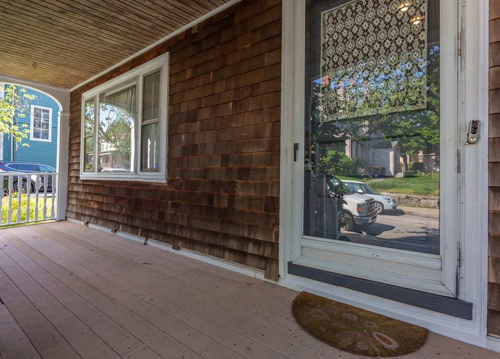 724 High Street Fall River, MA 02720 - Photo 5 of 39 a view of an empty room with a window and wooden floor