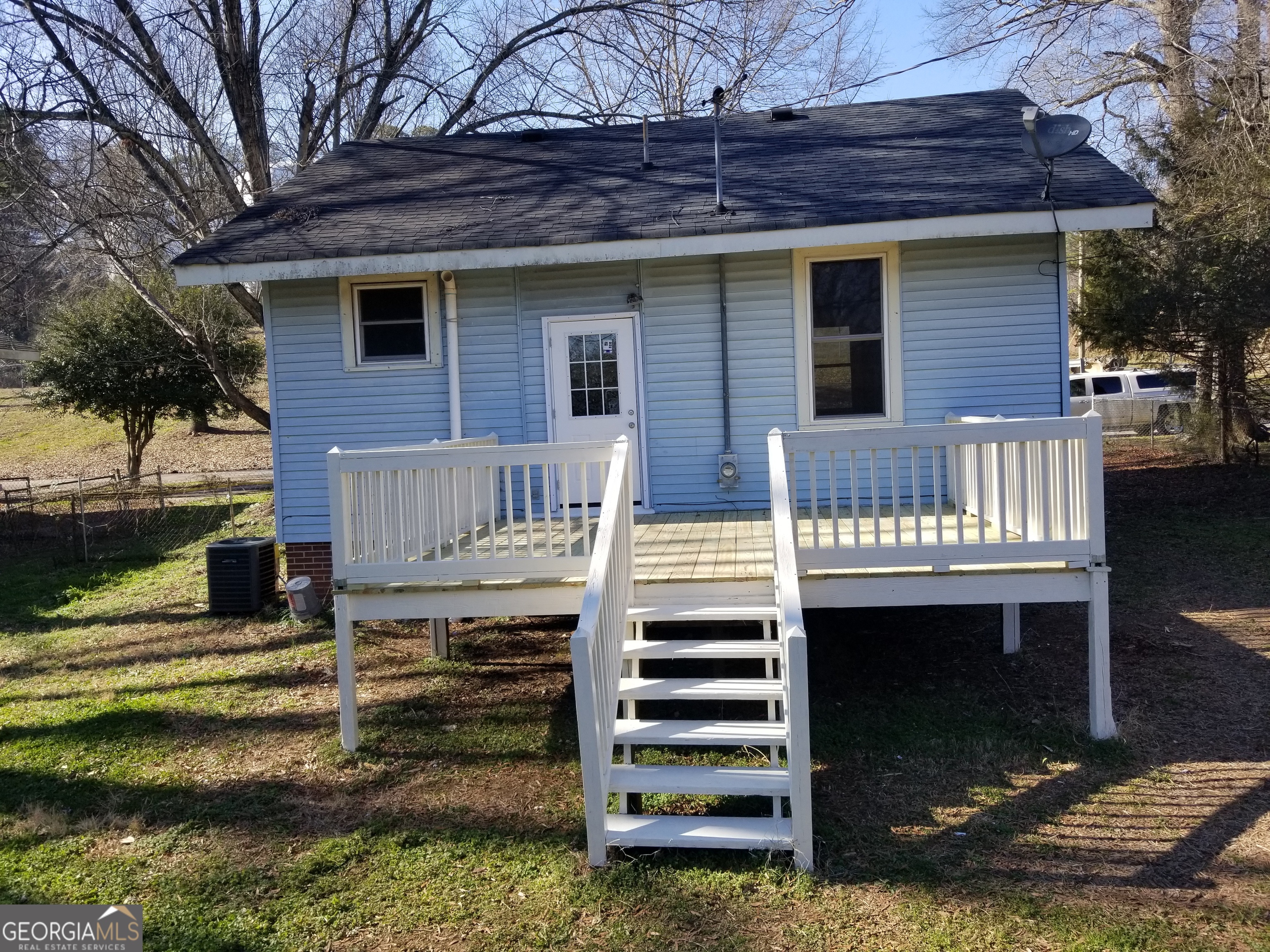 215 4th Street Rome, GA 30161 - Photo 11 of 12 a view of a patio with table and chairs with wooden floor and fence