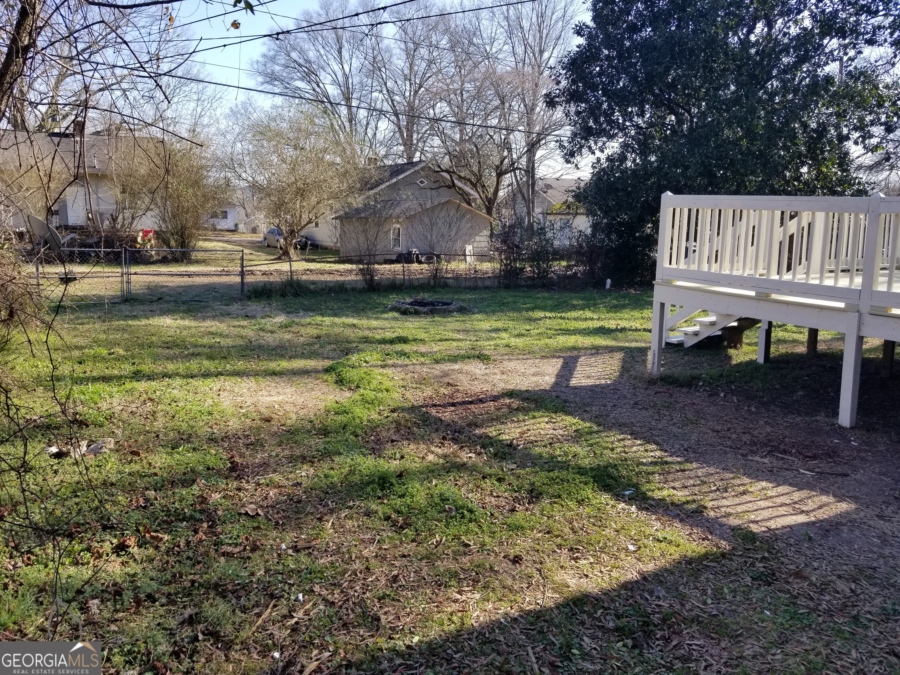 215 4th Street Rome, GA 30161 - Photo 12 of 12 a view of backyard with wooden fence and a bench