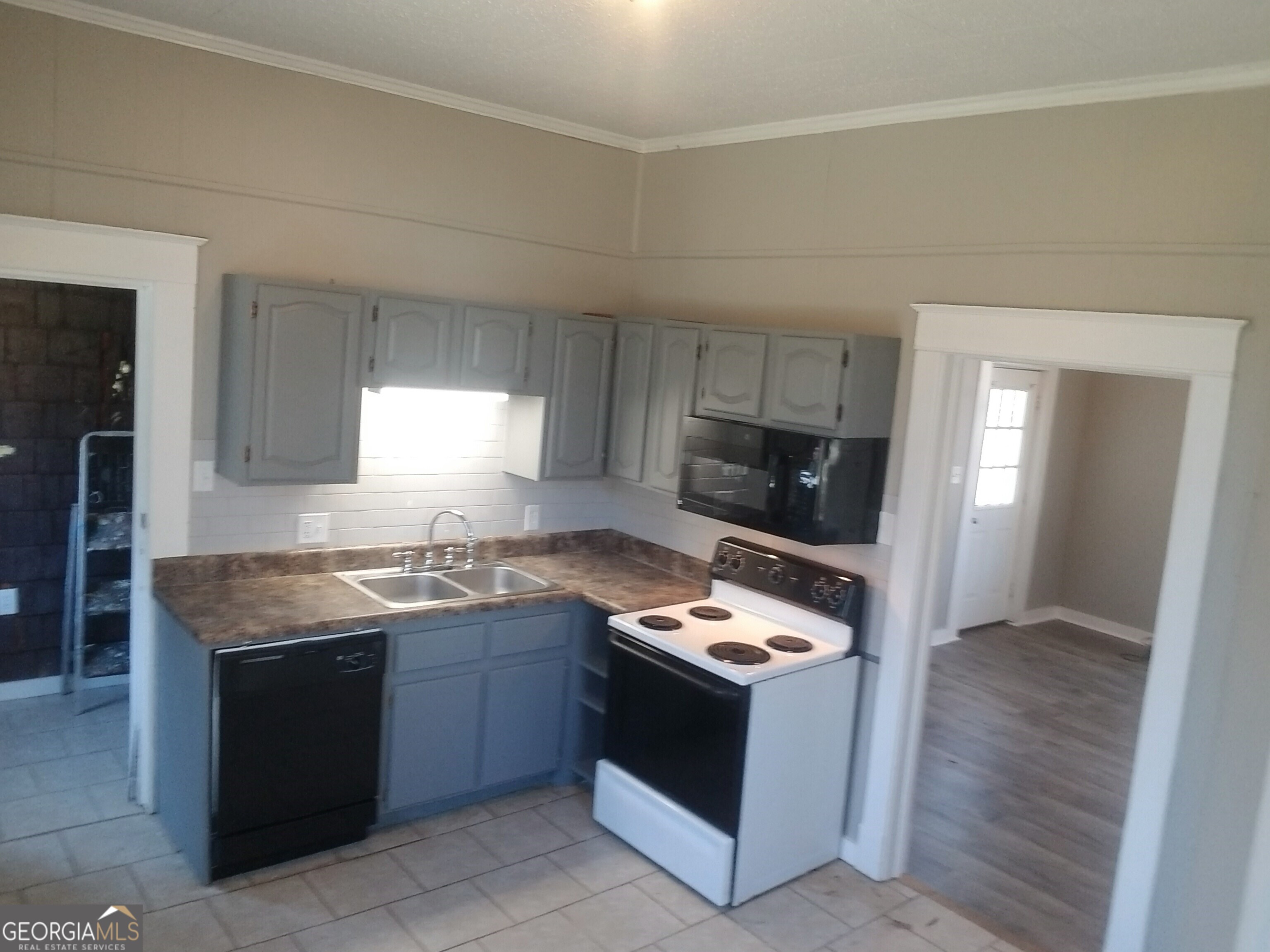 215 4th Street Rome, GA 30161 - Photo 2 of 12 a kitchen with a stove and a sink