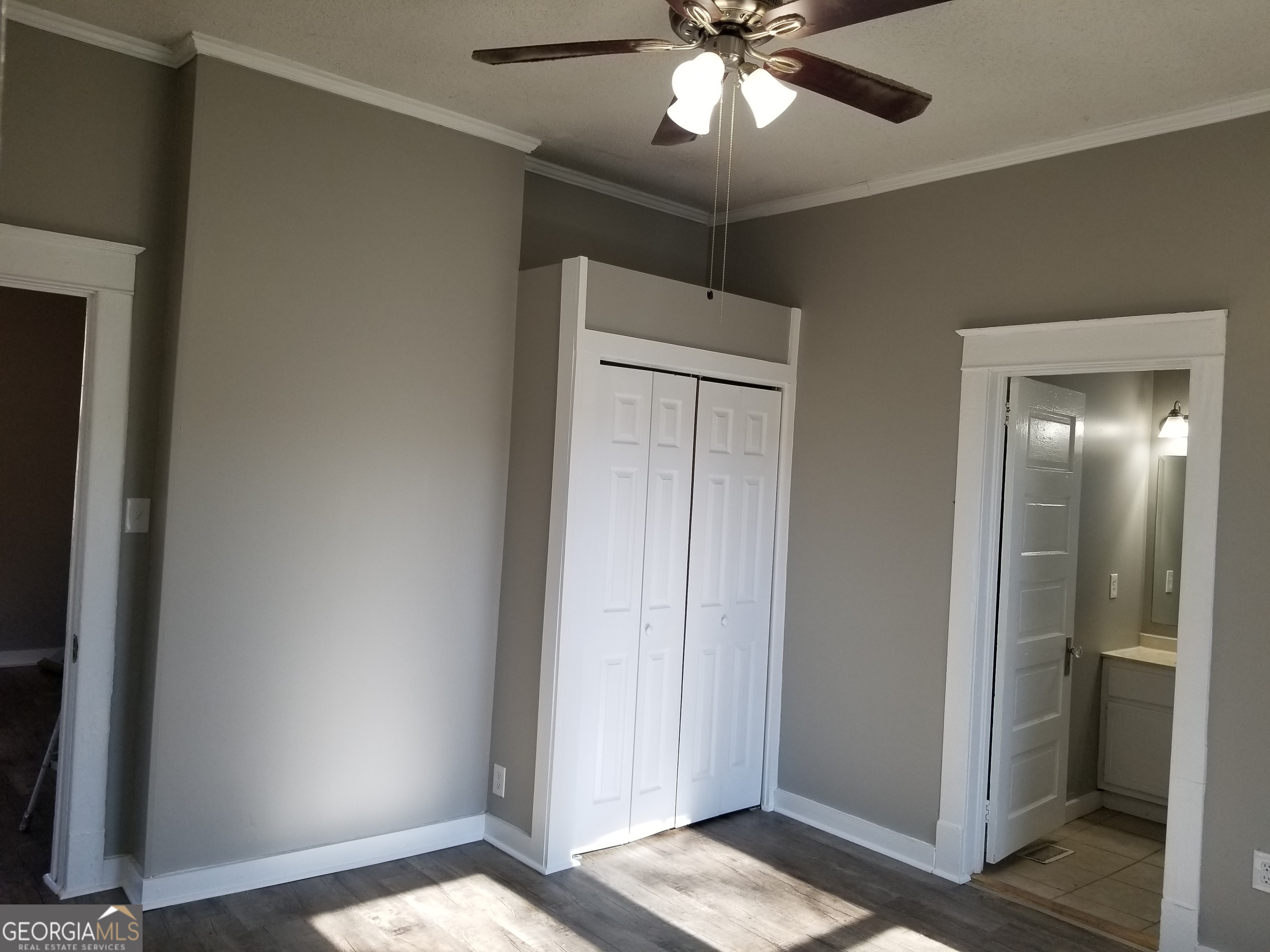 215 4th Street Rome, GA 30161 - Photo 6 of 12 a view of an empty room and bathroom with a mirror