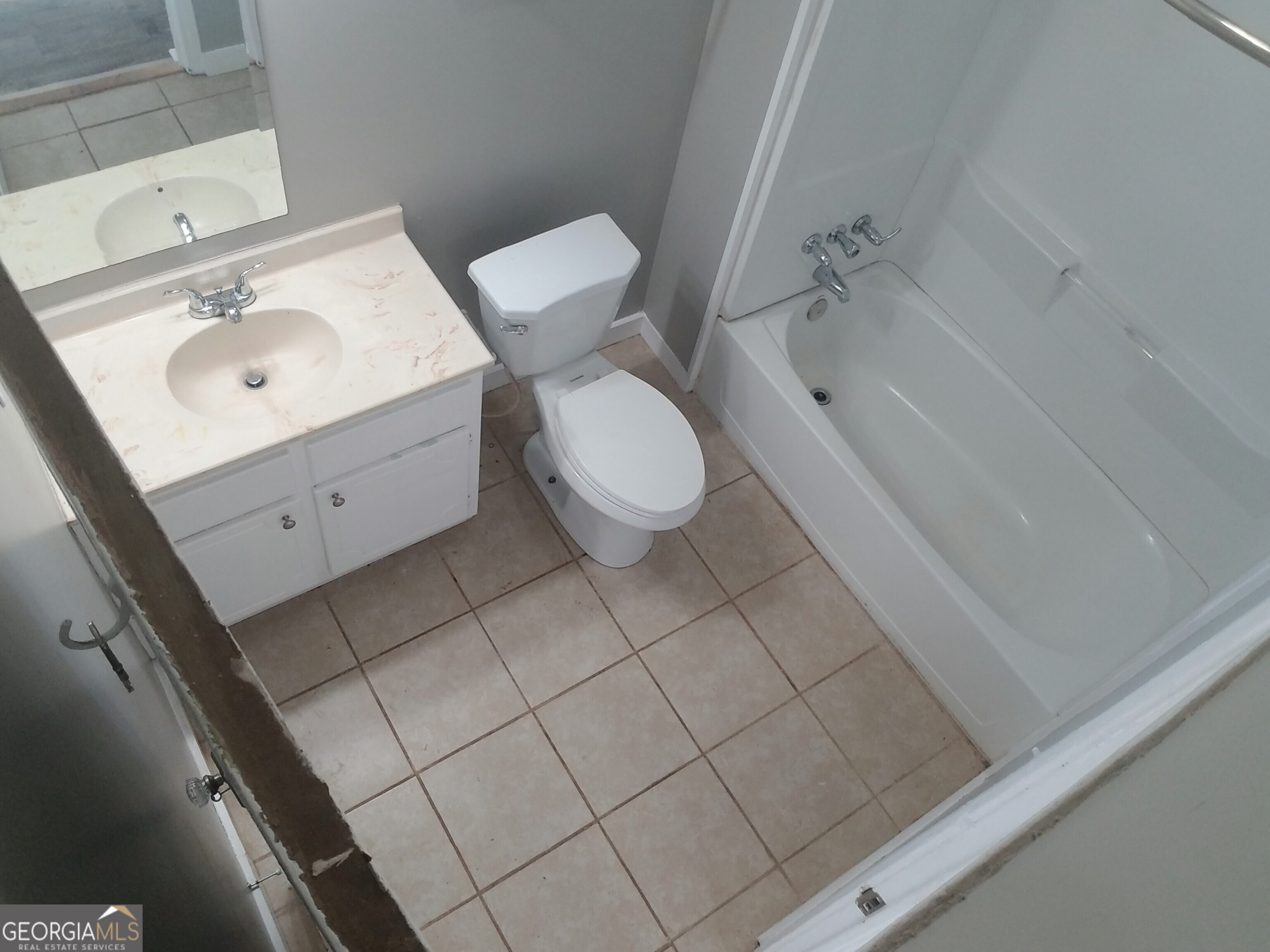215 4th Street Rome, GA 30161 - Photo 7 of 12 a bathroom with a sink mirror and toilet