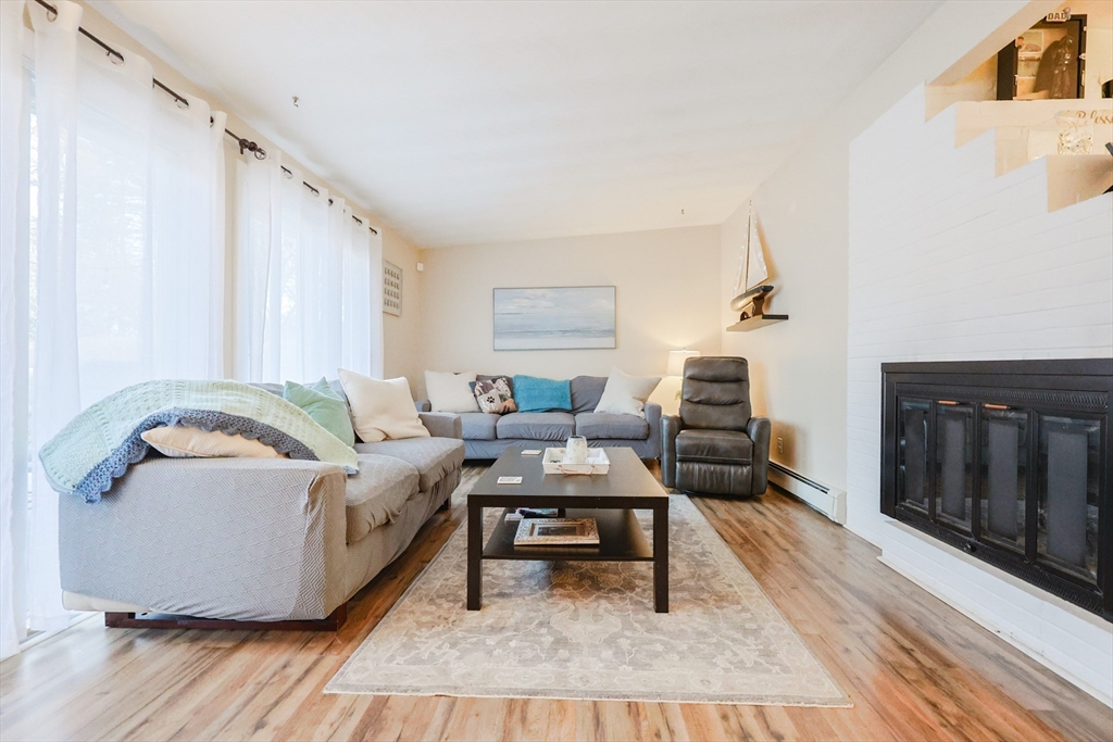11 Edith Road Framingham, MA 01701 - Photo 12 of 37 a living room with furniture and a wooden floor