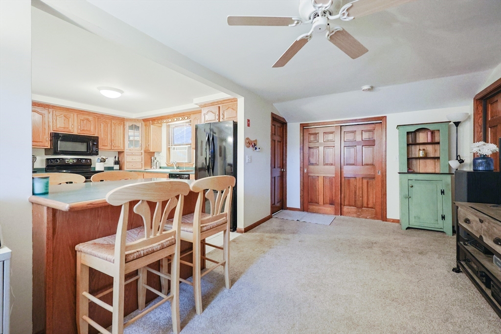11 Edith Road Framingham, MA 01701 - Photo 15 of 37 a view of a livingroom with furniture window and a kitchen