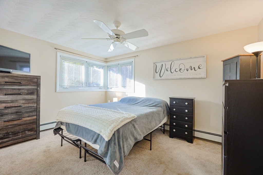 11 Edith Road Framingham, MA 01701 - Photo 17 of 37 a bedroom with a bed and a ceiling fan