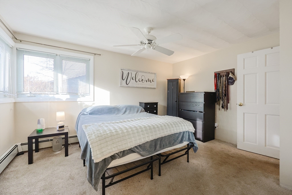 11 Edith Road Framingham, MA 01701 - Photo 20 of 37 a bedroom with a bed and a table in it