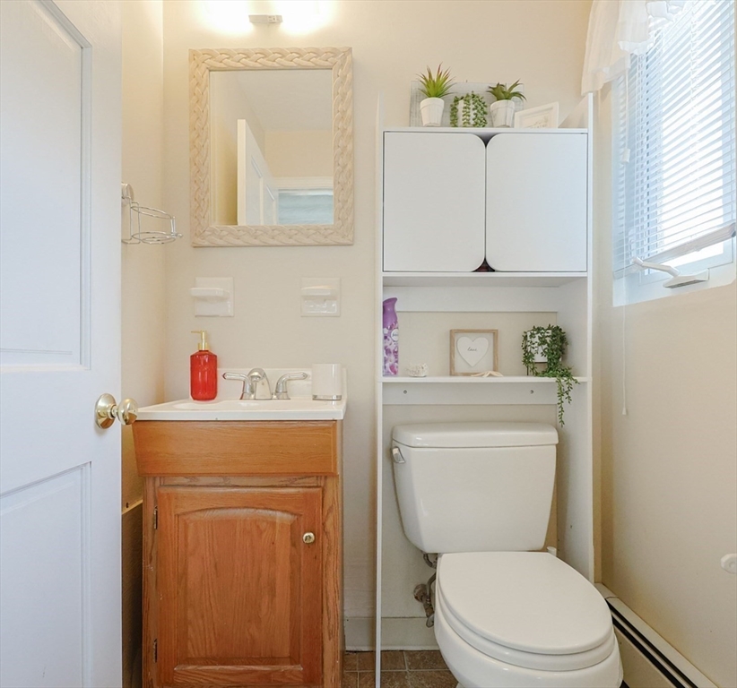 11 Edith Road Framingham, MA 01701 - Photo 21 of 37 a bathroom with a toilet sink and mirror