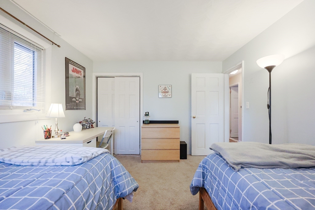 11 Edith Road Framingham, MA 01701 - Photo 23 of 37 a bedroom with a bed and dresser