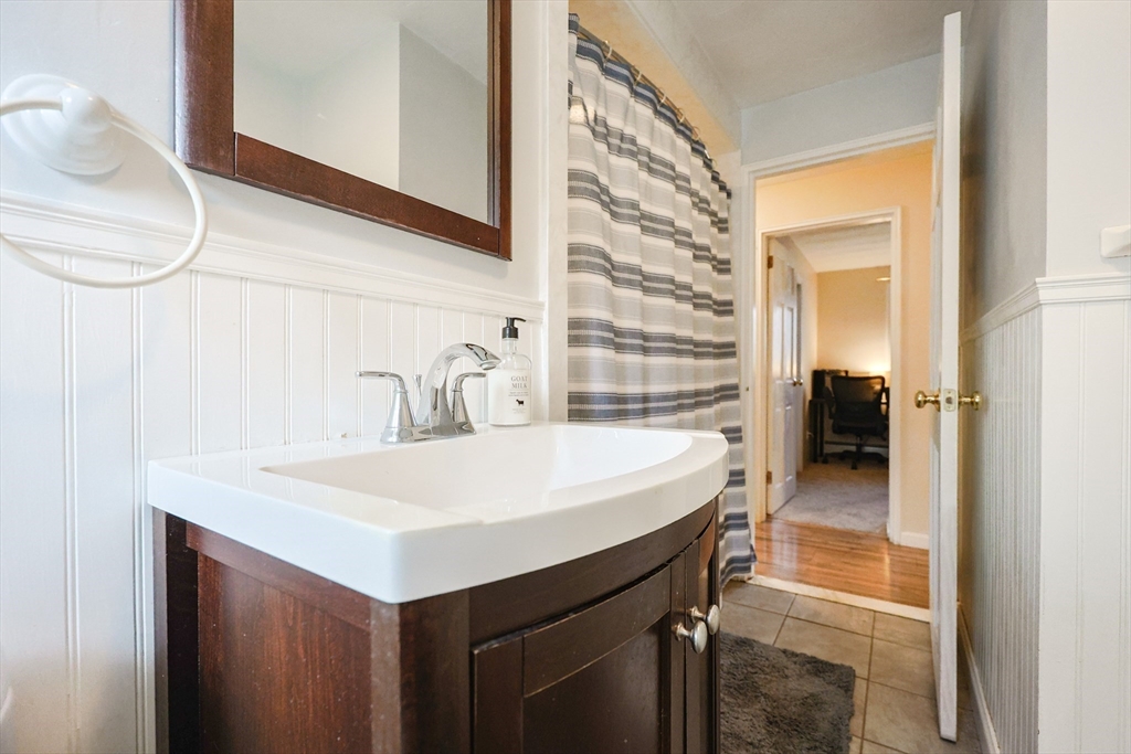 11 Edith Road Framingham, MA 01701 - Photo 27 of 37 a utility room with a sink and a refrigerator