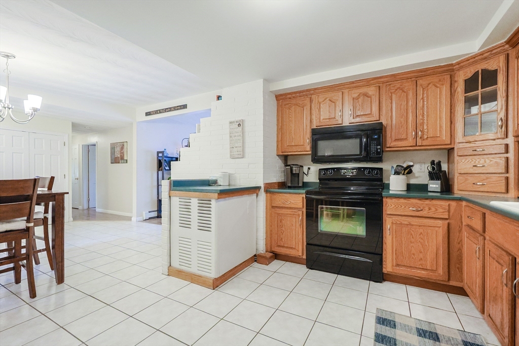 11 Edith Road Framingham, MA 01701 - Photo 7 of 37 a kitchen with stainless steel appliances granite countertop a stove a sink and a refrigerator