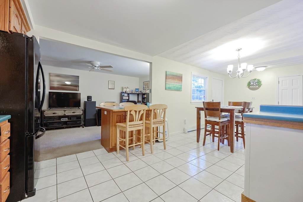 11 Edith Road Framingham, MA 01701 - Photo 9 of 37 a large kitchen with a table and chairs in it