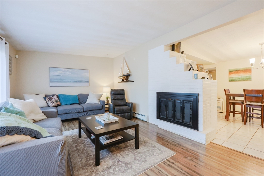 11 Edith Road Framingham, MA 01701 - Photo 10 of 37 a living room with furniture and a fireplace