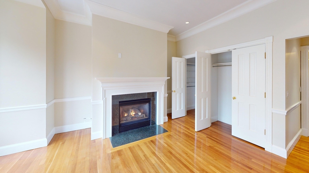 22 Beacon Street, Unit 3 Boston, MA 02108 - Photo 17 of 28 a living room with furniture and a fireplace
