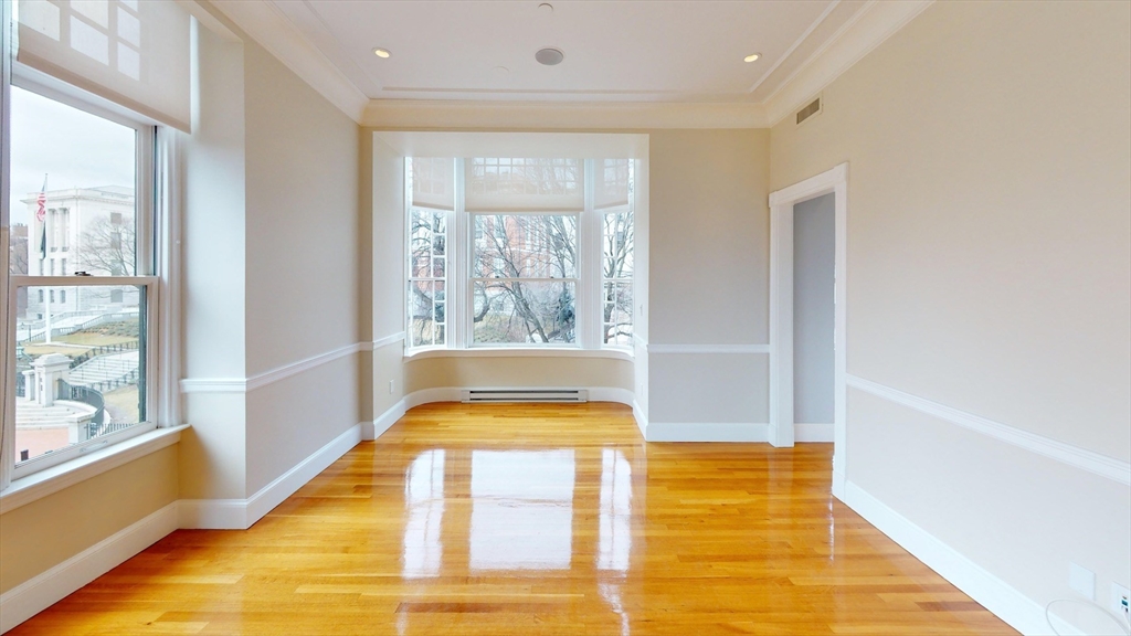 22 Beacon Street, Unit 3 Boston, MA 02108 - Photo 18 of 28 a bathroom with a bathtub and window