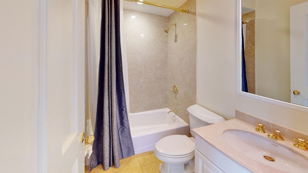 22 Beacon Street, Unit 3 Boston, MA 02108 - Photo 21 of 28 a bathroom with a sink a toilet a tub and shower