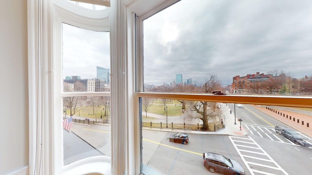 22 Beacon Street, Unit 3 Boston, MA 02108 - Photo 24 of 28 a view of a glass door and a balcony