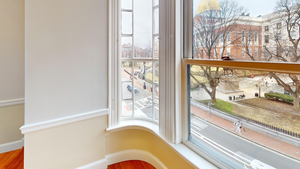 22 Beacon Street, Unit 3 Boston, MA 02108 - Photo 26 of 28 a view of a living room with a floor to ceiling window