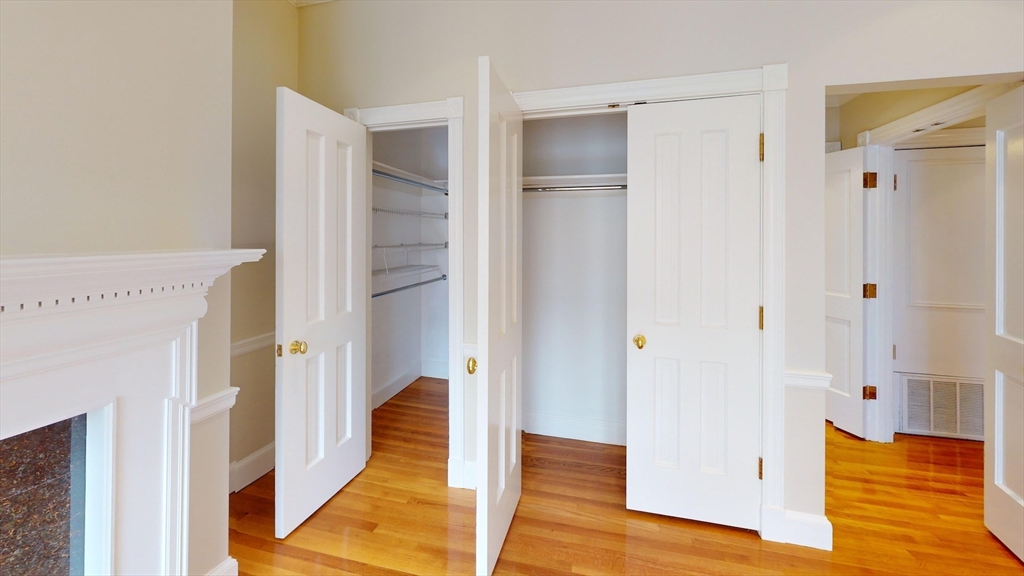 22 Beacon Street, Unit 3 Boston, MA 02108 - Photo 6 of 28 a view of a hallway with wooden floor and staircase