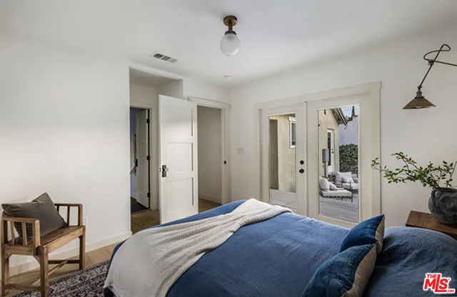 a bedroom with a bed and furniture