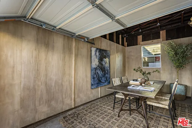 a view of a dining room with furniture and window
