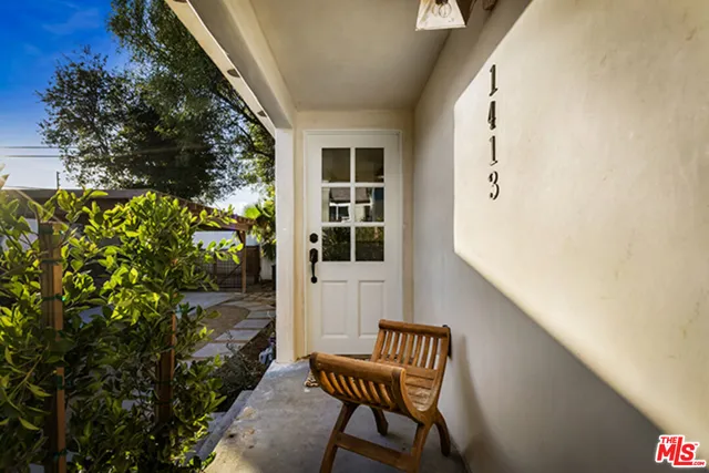 a view of a two chairs in the balcony
