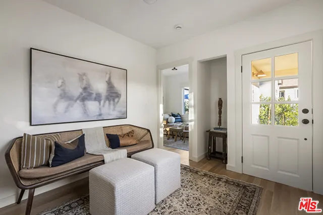 a bedroom with furniture and a rug