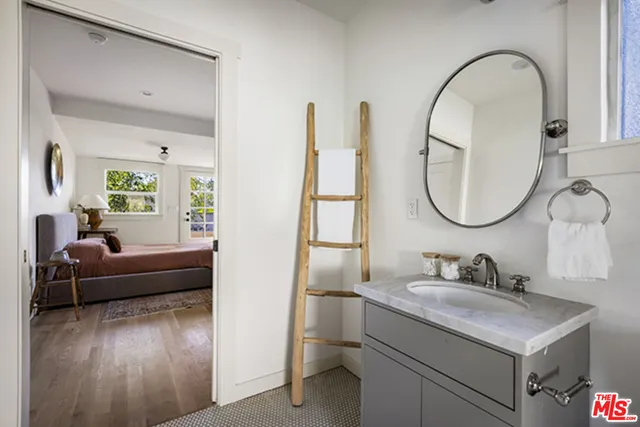 a en suite bathroom with a sink and a mirror