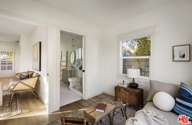 a bedroom with furniture and a window
