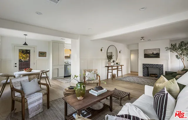 a living room with furniture couches and a fireplace