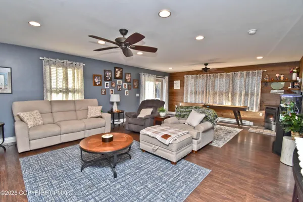 a living room with furniture and a large window