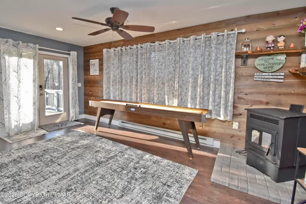 a living room with furniture a rug and a fireplace