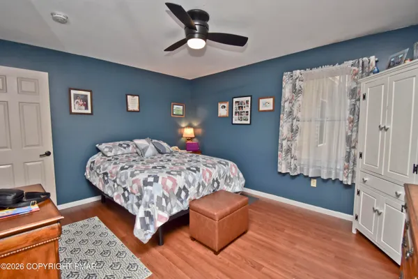 a bed room with a bed and a lamp