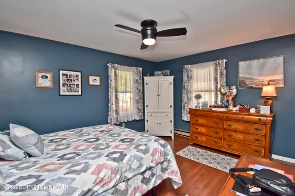 a bedroom with furniture and a window