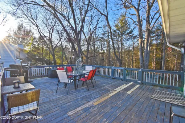 a view of a yard with large trees
