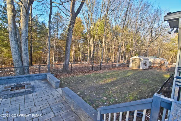 a view of a small house with a patio