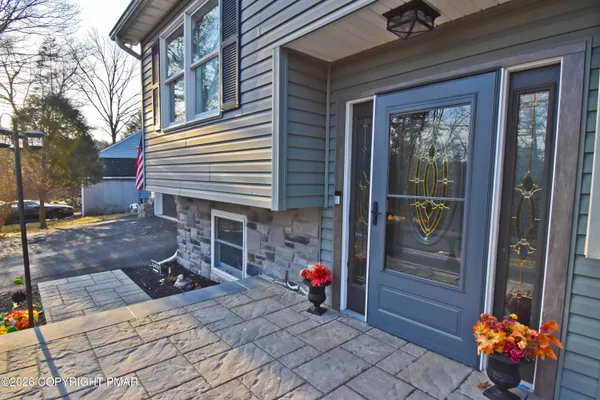 front view of a house with a yard