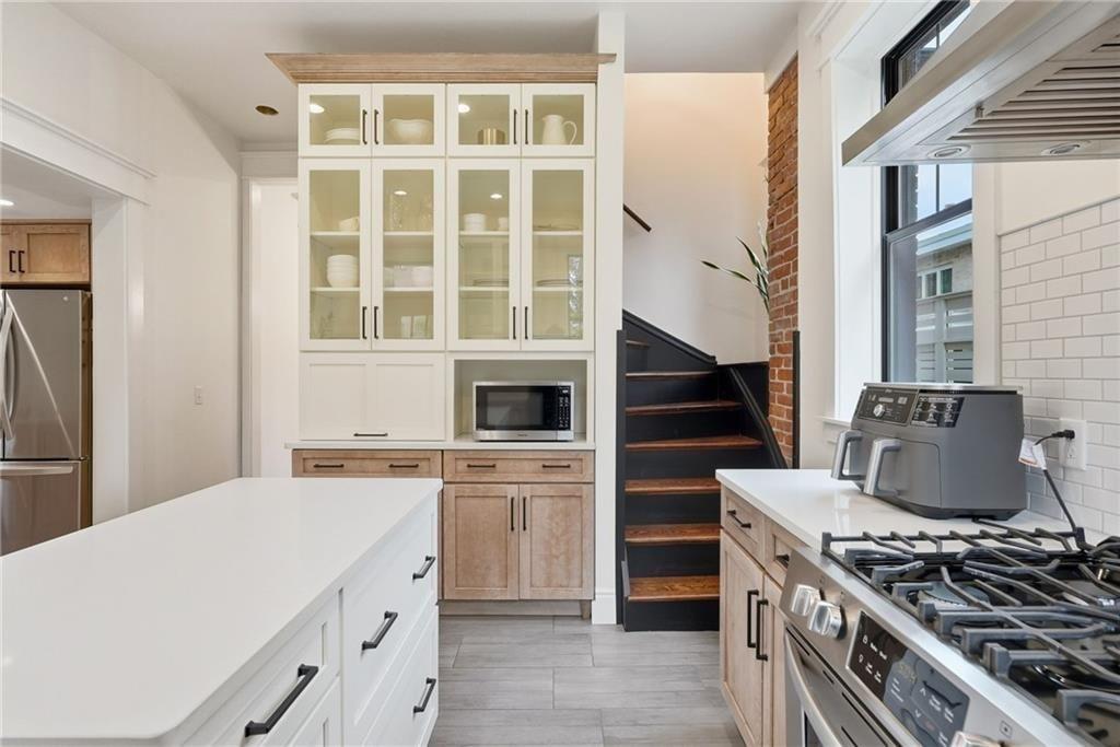 4749 Wallingford Street Pittsburgh, PA 15213 - Photo 19 of 49 a kitchen with a stove oven and sink