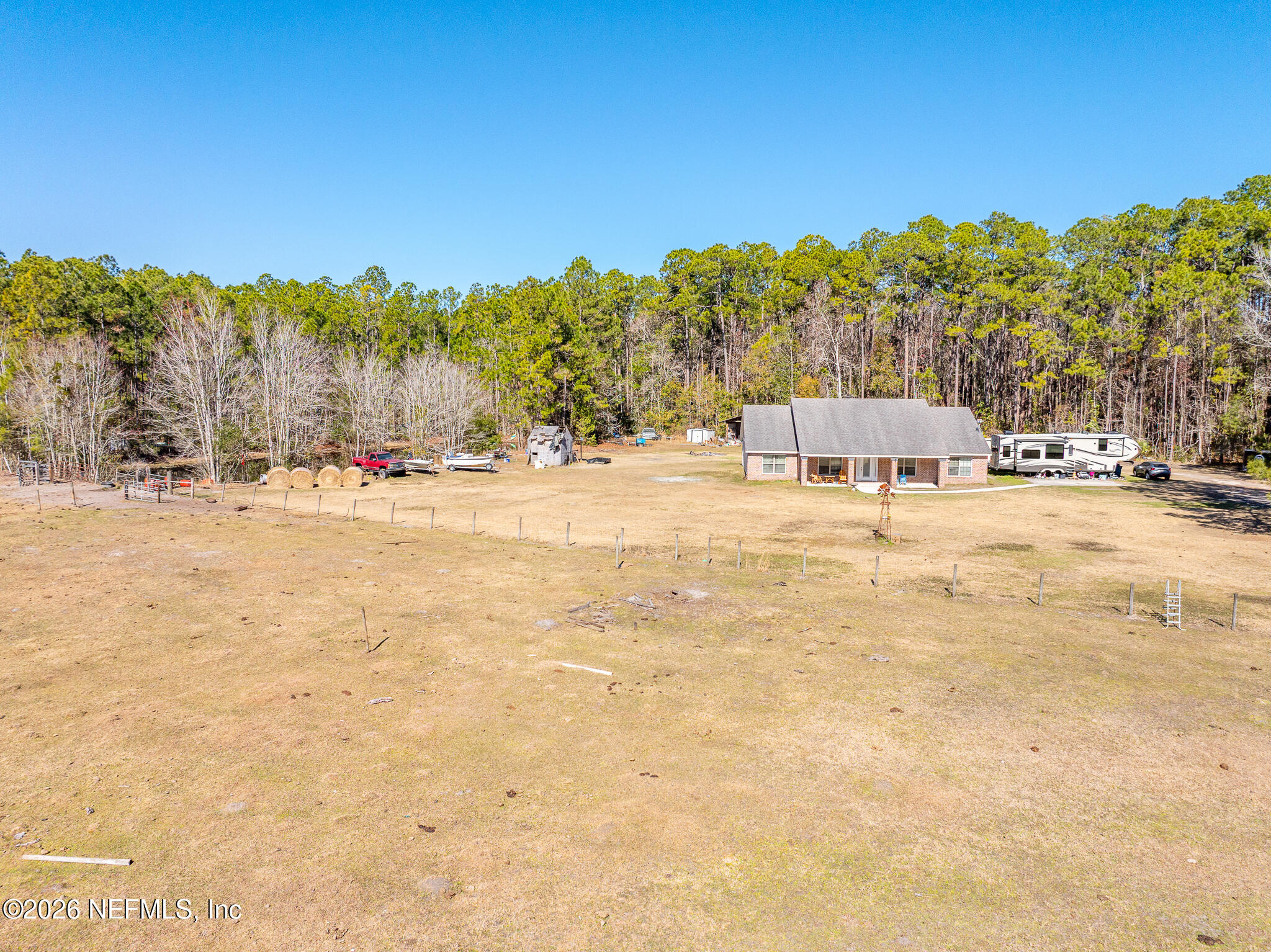 1725 Davidson Farm Road Jacksonville, FL 32218 - Photo 50 of 53 a swimming pool with trees in the background