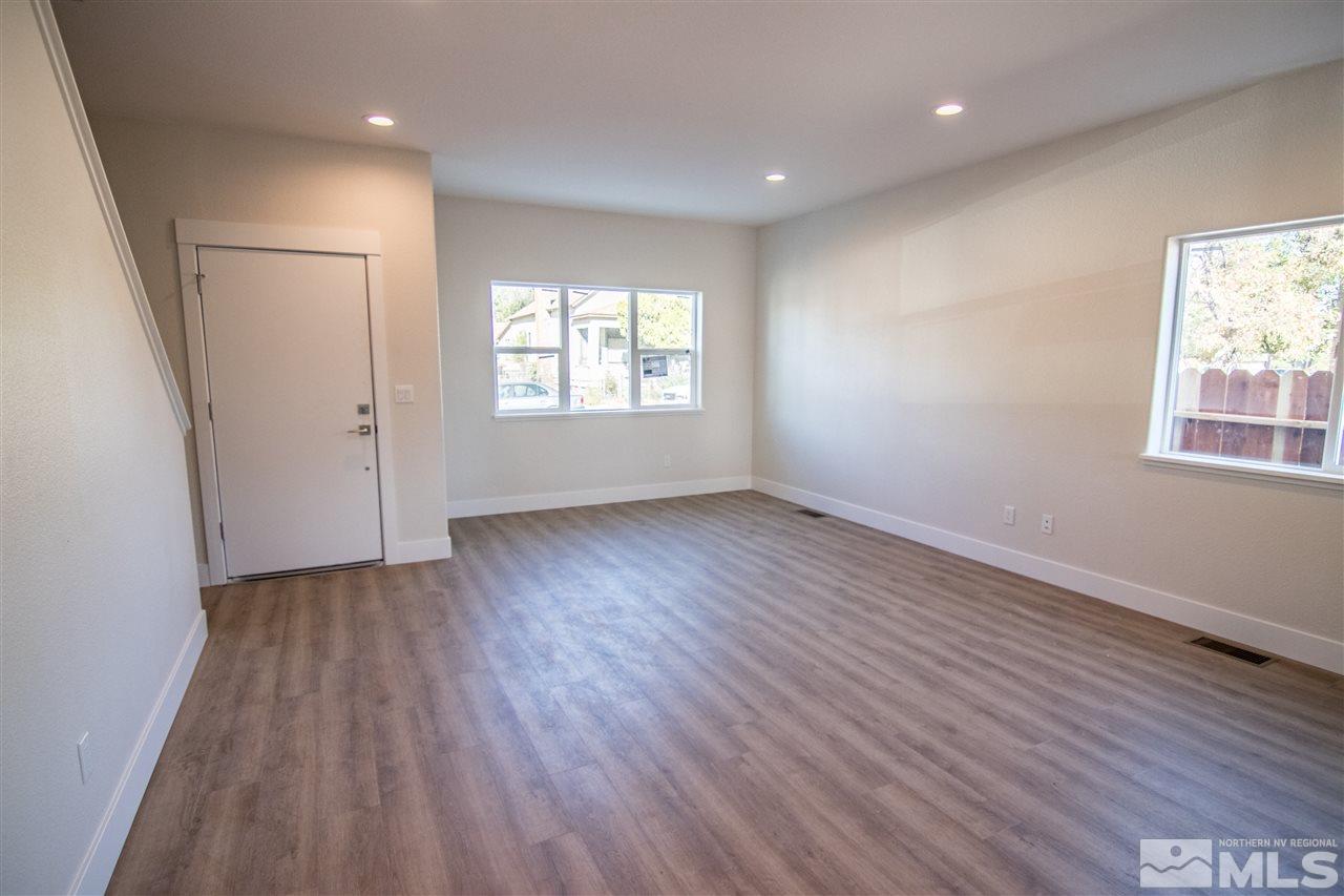 40 Park Street Reno, NV 89502 - Photo 8 of 16 an empty room with wooden floor and windows