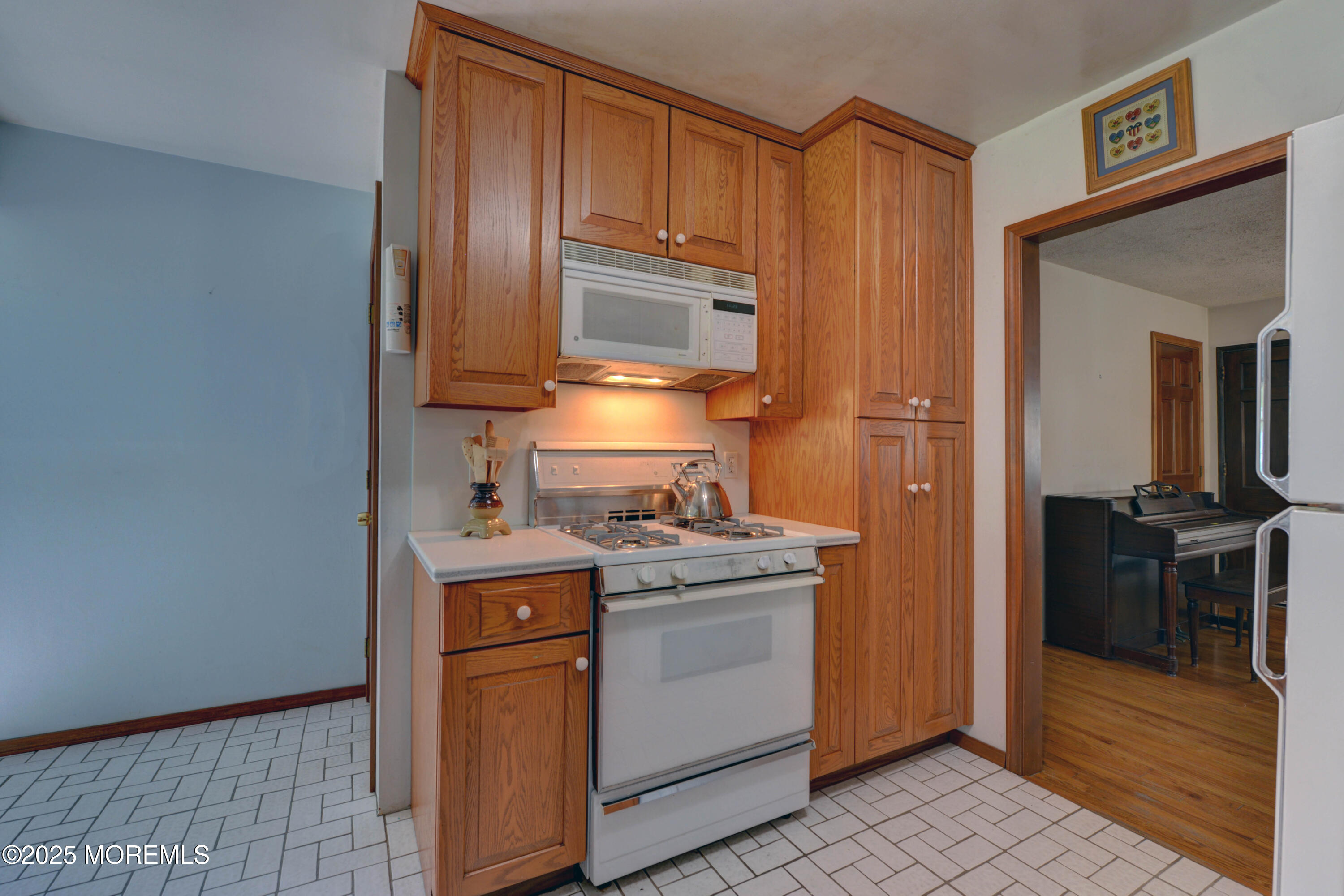 26 Old Manor Road Holmdel, NJ 07733 - Photo 16 of 37 a kitchen with a stove sink and cabinets