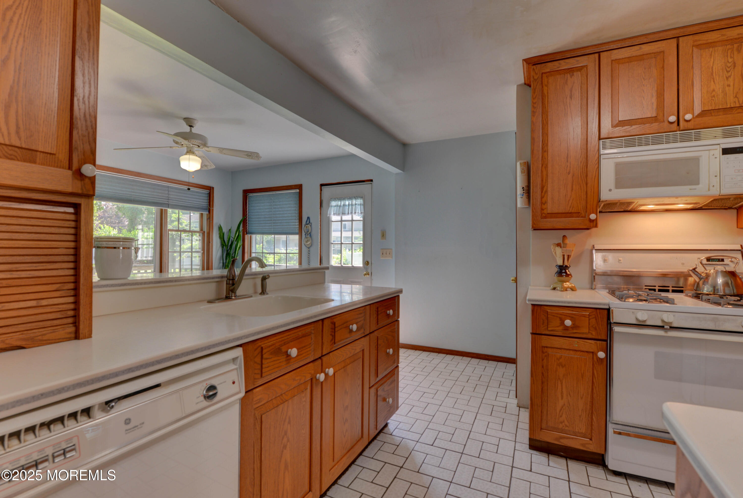 26 Old Manor Road Holmdel, NJ 07733 - Photo 17 of 37 a kitchen with granite countertop cabinets stainless steel appliances a sink and a window