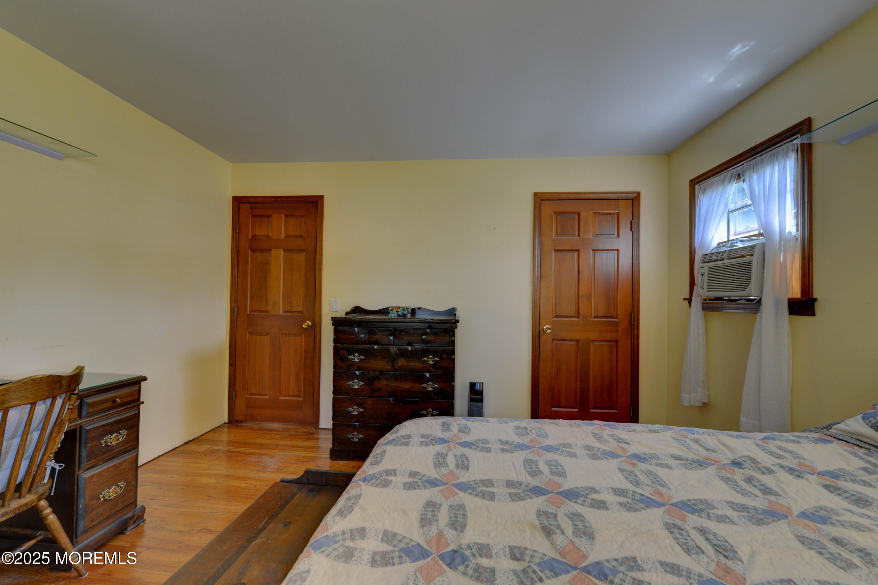 26 Old Manor Road Holmdel, NJ 07733 - Photo 21 of 37 a bedroom with a bed and wooden floor