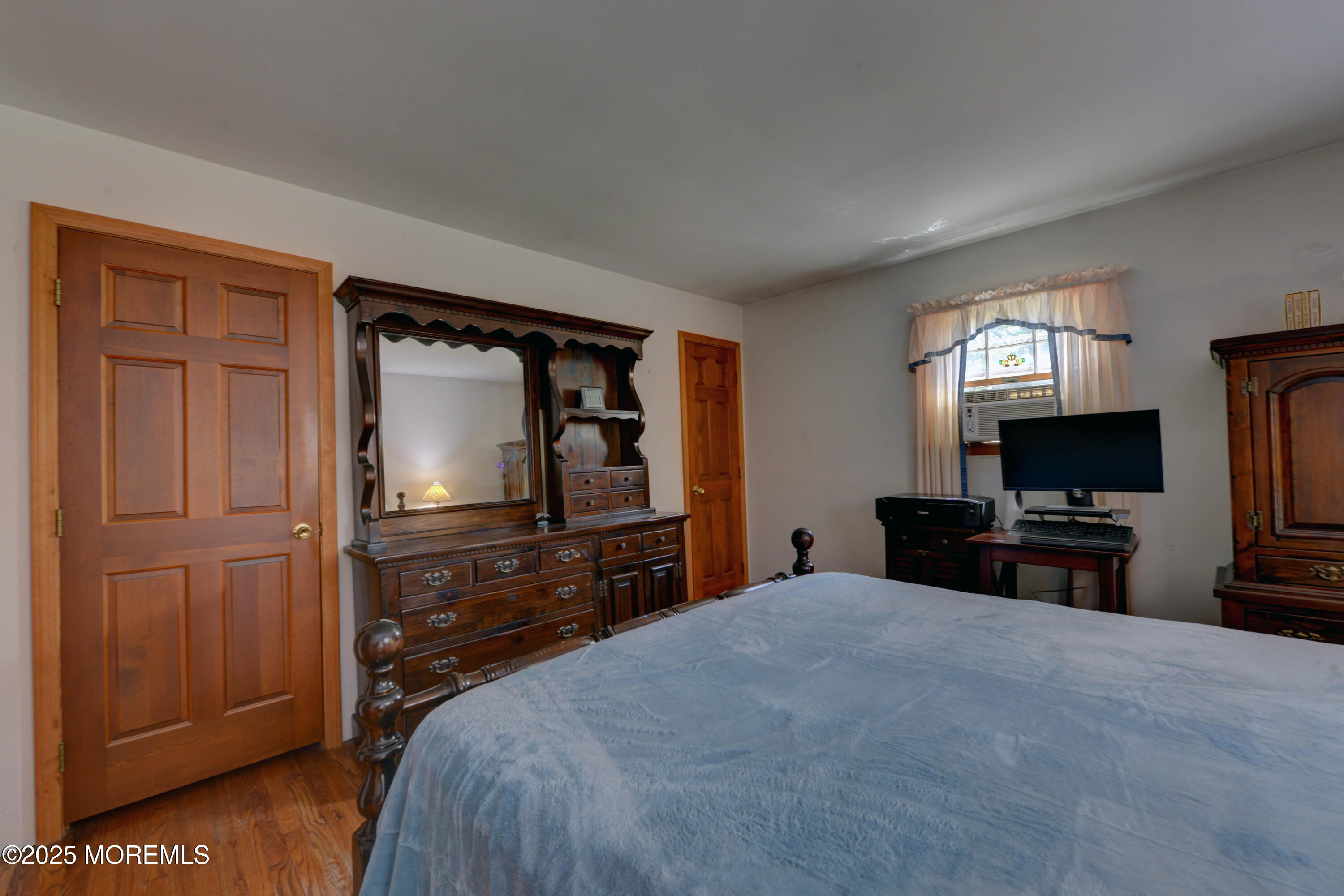 26 Old Manor Road Holmdel, NJ 07733 - Photo 23 of 37 a bedroom with a bed and a television in it