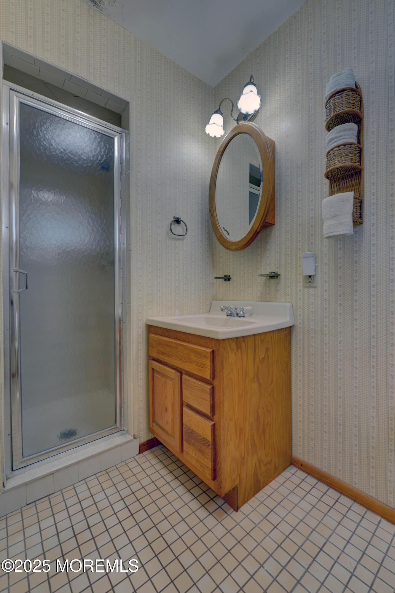 26 Old Manor Road Holmdel, NJ 07733 - Photo 25 of 37 a bathroom with a sink a mirror and a shower