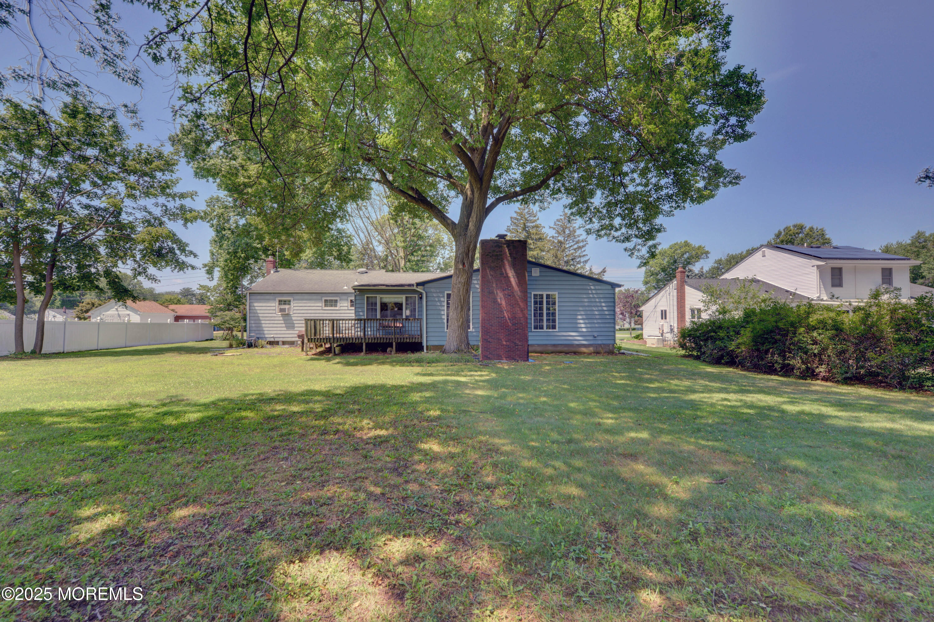 26 Old Manor Road Holmdel, NJ 07733 - Photo 33 of 37 a front view of a house with a garden